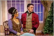  ?? CONTRIBUTE­D BY DAVID WOOLF ?? Lizzy (Julissa Sabino) and Mr. Darcy (Lee Osorio) are nesting at Pemberley. impressive creation of frost on the windows using blue and white light. Costume designer Elizabeth Rasmusson dresses the entire cast sharply with the piece de resistance a long...