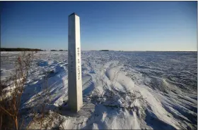  ?? JOHN WOODS — THE CANADIAN PRESS VIA AP ?? A border marker, between the United States and Canada is shown just outside of Emerson, Manitoba, on Thursday.