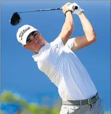  ?? Picture: GETTY ?? CHAMPION CHARGE: Justin Thomas of the US plays his shot from the 10th tee during the third round of the SBS Tournament of Champions at the Plantation Course at Kapalua Golf Club on Saturday in Lahaina, Hawaii