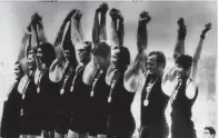  ?? Photo / Supplied ?? New Zealand rowers raise their arms after winning the gold medal at the 1972 Munich Olympics.