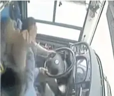  ??  ?? Security footage from the bus which crashed into a river revealed the driver was fighting with a passenger moments earlier.