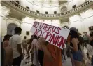  ?? Daemmrich/ZUMA Press Wire/REX/Shut- ?? University of Texas women rally at the Texas capitol to protest Greg Abbott’s signing of the abortion law. Photograph: Bob