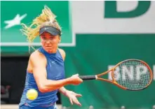  ?? THE ASSOCIATED PRESS ?? Ukraine’s Elina Svitolina slams a forehand to Croatia’s Petra Martic during their fourth-round match of the French Open tennis tournament at the Roland Garros stadium Monday in Paris.