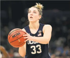  ?? Mike Ehrmann / Getty Images ?? UConn’s Katie Lou Samuelson attempts a free throw against Notre Dame during the third quarter in the semifinals of the NCAA Final Four in 2019.