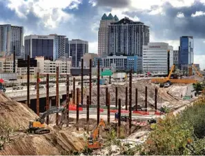  ?? JOE BURBANK/ORLANDO SENTINEL ?? This view from north of downtown Orlando shows an unfinished portion of the Ultimate I-4 project as constructi­on continues on the massive Interstate 4 bridge work.