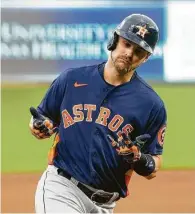  ?? Charlie Riedel / Associated Press ?? Josh Reddick tours the bases after a two-run homer to right field in the fourth inning.