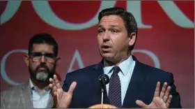  ?? (AP file photo) ?? Florida Gov. Ron DeSantis, shown during a speech earlier this month, on Tuesday authorized state law officers “to detain” any vehicle thought to be transporti­ng people who are in the country illegally.