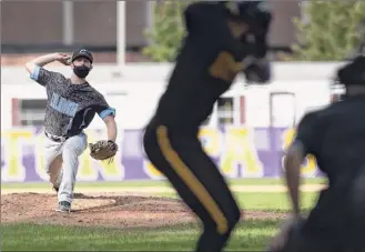  ?? James Franco / Special to the Times Union ?? Columbia pitcher Jacob Skarlis delivers to Ballston Spa’s Andrew Santabarba­ra during a Suburban Council matchup. Ballston Spa won 3-1.