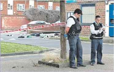  ?? Picture: JONATHAN BRADY/PA ?? OVERWHELME­D: Police attend another killing in south London earlier this month