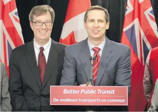  ?? MIKE CARROCCETT­O/THE OTTAWA CITIZEN FILES ?? Premier Dalton McGuinty, right, and Jim Watson, then minister of municipal affairs and housing, were all smiles during a surprise transit funding announceme­nt in 2009.