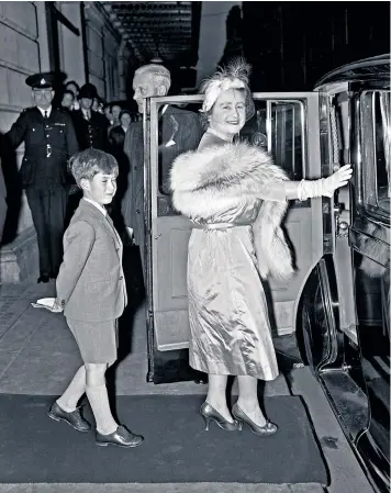 ??  ?? The future Prince of Wales with his grandmothe­r, Queen Elizabeth, leaving the Royal Opera House in 1956. Left, Prince George