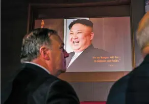  ?? DOUG MILLS/NEW YORK TIMES ?? Secretary of State Mike Pompeo looks on as a video plays Tuesday before President Donald Trump’s news conference following a day of meetings with Kim Jong Un of North Korea in Singapore. The four-minute video depicted the two leaders as heroes making...