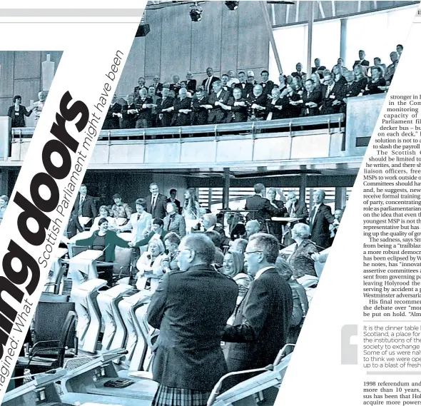  ?? ?? MSPS and chamber guests sing Auld Lang Syne in the new Scottish Parliament at Holyrood, Edinburgh, during a ceremony to mark its official opening on October 9, 2004