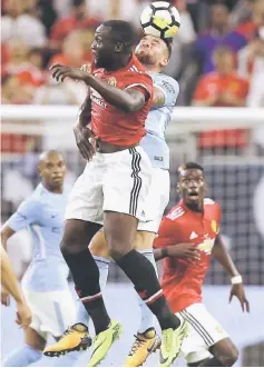  ??  ?? Nicolas Otamendi of Manchester City gets his head on the ball as Manchester United’s Romelu Lukaku challenges at NRG Stadium in Houston, Texas. — AFP photo