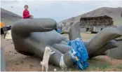  ?? — AFP ?? A boy plays around the constructi­on site of the Grand Maitreya Spiritual Centre in Ulan Bator, Mongolia.