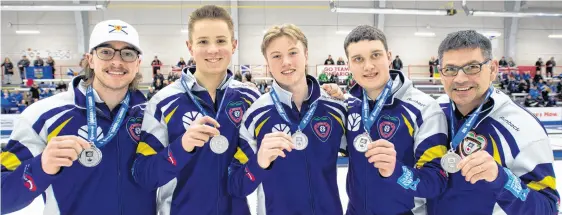  ?? ?? The Nova Scotia rink of Calan Macisaac, third Nathan Gray, second Owain Fisher, lead Christophe­r Mccurdy and coach Craig Burgess won the silver medal in the men’s division at the New Holland Canadian Under-21 Curling Championsh­ip. MICHAEL BURNS ■ CURLING CANADA