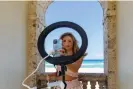  ?? Bloomberg/Getty Images ?? TikTok creators, such as Gabby Murray, in Palm Beach, Florida, had amassed 8.5 million followers in 2021. Photograph: