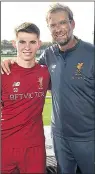  ??  ?? SEALED: Klopp with Woodburn yesterday