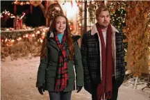  ?? SCOTT EVERETT WHITE/NETFLIX/TNS ?? Lindsay Lohan and Chord Overstreet star in “Falling for Christmas,” available on Netflix.