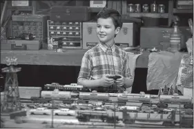  ??  ?? Young Sheldon stars Iain Armitage (Big Little Lies) as 9-year-old genius Sheldon Cooper. He’s shown here in his favorite pastime, playing with trains.