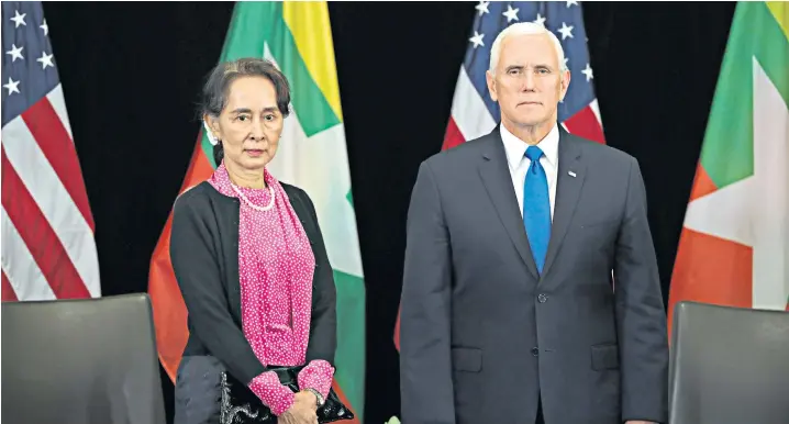  ??  ?? Mike Pence challenged Aung San Suu Kyi over Burma’s treatment of the Rohingya Muslims during yesterday’s summit in Singapore