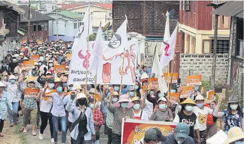  ?? PHOTOS BY AFP ?? Protesters take part in a demonstrat­ion against the military coup in Mogok town, north of Mandalay, on Friday.