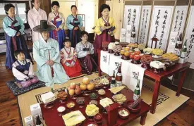  ??  ?? In Chuseok, families prepare a charye, wherein various Korean foods are prepared and placed on a table, along with piles of fresh fruit. Arranged in a specific order, the food is offered to the ancestors, whose spirits are thought to protect the living.