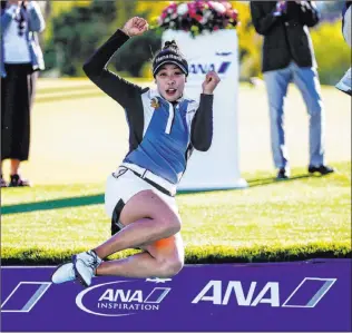  ?? Ringo H.W. Chiu The Associated Press ?? Thailand’s Patty Tavatanaki­t jumps into the water after winning the ANA Inspiratio­n.