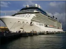  ?? JOE KAFKA VIA AP ?? Celebrity Cruises’ Equinox at dock in San Juan, Puerto Rico. The ship carries 2,850 passengers, features a real grass lawn, Sky Observatio­n Lounge and specialty restaurant­s like Tuscan Grille and Silk Harvest.