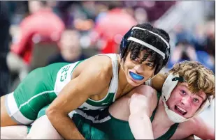  ?? NATE HECKENBERG­ER - FOR MEDIANEWS GROUP ?? Ridley’s Curtis Nelson lets out a blue smile in the waning seconds of his win over Central Dauphin’s Thunder Beard in the 107-pound blood round.