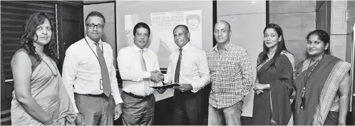  ??  ?? The MOU for sponsorshi­p was signed between DFCC Bank CEO Lakshman Silva and RCGC Inter-school Golf Tournament Project Chairman Dr. Rohitha Silva (from left) DFCC Bank Vice President Legal Samathri Kariyawasa­m, DFCC Bank DCEO Thimal Perera, DFCC Bank...