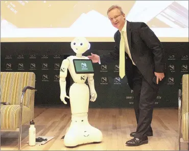  ?? PHOTO: DIMPHO MAJA/AFRICAN NEWS AGENCY (ANA) ?? Chief executive of Nedbank Mike Brown and robot Pepper underscore the bank is tech-savvy.