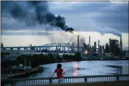  ?? MATT ROURKE, FILE - THE ASSOCIATED PRESS ?? In this June 21 file photo, flames and smoke emerge from the Philadelph­ia Energy Solutions Refining Complex in Philadelph­ia. Federal investigat­ors blamed an aging elbow pipe that hadn‚Äôt been inspected in decades.