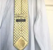  ??  ?? Gold standard The silk tie previously worn by President Trump fetched £6200