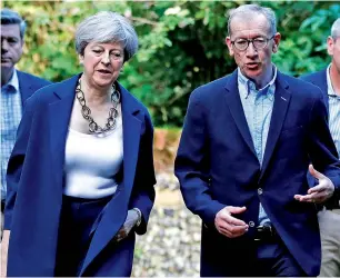  ?? Reuters ?? Theresa May and her husband Phillip arrive at church in Sonning, Britain, on Sunday. —