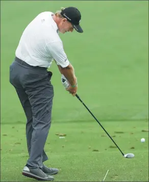  ?? AP ?? Ernie Els gets into the swing on the driving range during practice for the Masters on Monday in Augusta, Georgia. Having played the event 22 times, and with his qualificat­ion exemption now expired, this year could be the 47-year-old South African’s...