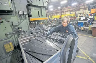  ?? JESSICA REILLY — TELEGRAPH HERALD VIA ASSOCIATED PRESS ?? A worker sorts product at EIP Manufactur­ing in Earlville, Iowa. With million of Americans vaccinated and most of the U.S. back to business as usual, the manufactur­ing sector is struggling to keep up with demand.