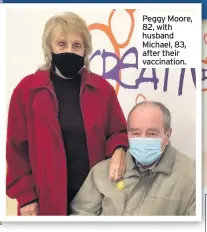  ??  ?? Peggy Moore, 82, with husband Michael, 83, after their vaccinatio­n.