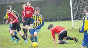  ??  ?? Dundee West U/14 (yellow and blue) beat Montrose 6-1 in the Dundee West Anniversar­y Cup semi-final at Downfield Park.