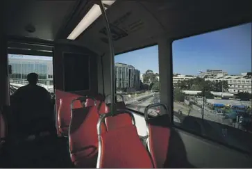  ?? K.C. Alfred San Diego Union-Tribune ?? A TROLLEY along the Blue Line of the San Diego Metropolit­an Transit System heads toward UC San Diego.