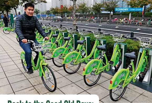  ??  ?? A thousand brand-new bikes for rent are neatly placed in 34 service stations in Zhengdong New District CBD of Zhengzhou, Henan Province.