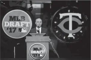  ?? The Associated Press ?? AND THE FIRST PICK IS: Commission­er Rob Manfred announces the Minnesota Twins selection of Royce Lewis, a shortstop and outfielder from JSerra Catholic High School in San Juan Capistrano, Calif., with the No. 1 pick in the first round of the Major...