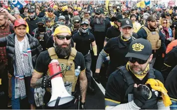  ?? LUIS M. ALVAREZ/AP ?? Proud Boys member Jeremy Joseph Bertino, second from left, attends a rally at Freedom Plaza, Dec. 12, 2020, in Washington. Bertino told jurors on Tuesdaytha­t he viewed their far-right extremist organizati­on as “the tip of the spear” after the 2020 election.
