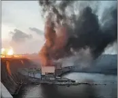  ?? THE ASSOCIATED PRESS ?? In this photo provided by the Telegram Channel of Ukraine’s Prime Minister Denys Shmyhal, smoke and fire rise over the Dnipro hydroelect­ric power plant after Russian attacks in Dnipro, Ukraine, on Friday.