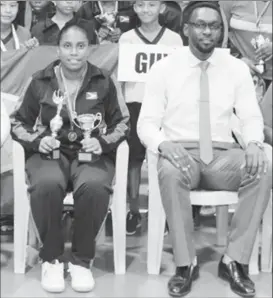  ??  ?? Priscilla Greaves and Director of Sport Christophe­r Jones following the conclusion of this year’s Caribbean Junior table tennis championsh­ips at the Cliff Anderson Sports Hall.