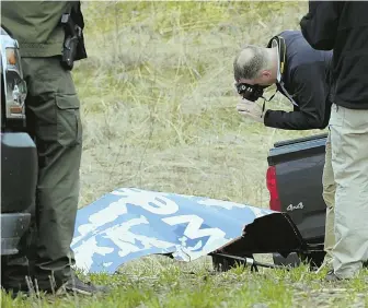  ?? AP PHOTOS ?? RECOMMENDA­TION DENIED: An NTSB investigat­or photograph­s a Southwest Airline engine cover Wednesday in a Pennsylvan­ia field. The debris was left behind after a fatal engine mishap that killed Jennifer Riordan, left.