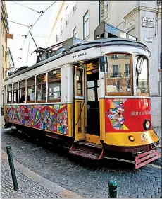  ?? Rick Steves’ Europe/DOMINIC ARIZONA BONUCCELLI ?? Lisbon’s trolleys can get unbearably crowded, so have a plan if you want to ride one.