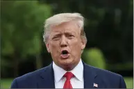  ?? Olivier Douliery / Tribune News Service ?? President Donald Trump talks to the media Tuesday afternoon before departing the White House in Washington, D.C., to attend a Make America Great Again Rally in Orlando, Fla.