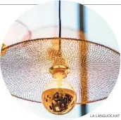  ?? LA LANGUOCHAT ?? A lacy disc sits like a hat atop a ball of copper and glass. The Eclipse suspension light is part of a capsule collection designed by Isabelle Royer for the French company La LanguOchat (www.lalanguoch­at.fr). It’s supported by an enameled copper wire crocheted by hand. This gives the luminaires a structure combining strength and lightness.