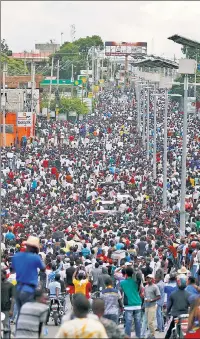  ??  ?? THEY’RE FED UP: Populist uprisings have been raging around the world, including in Haiti (left), Lebanon (top) and Chile (above), where protesters are railing against the ruling classes over economic issues.